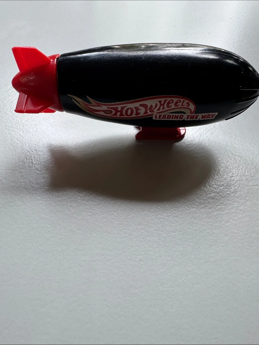 Black & Red Blimp Toy - Leading The Way